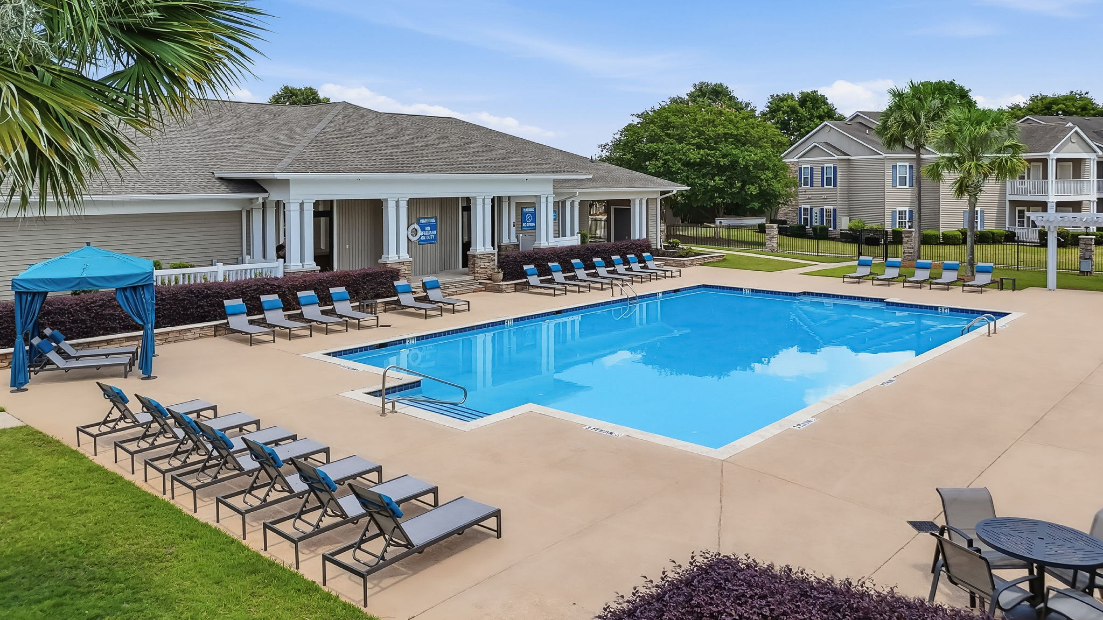 Tranquil poolside retreat with pergolas at Hawthorne Meadowview apartments in Warner Robins