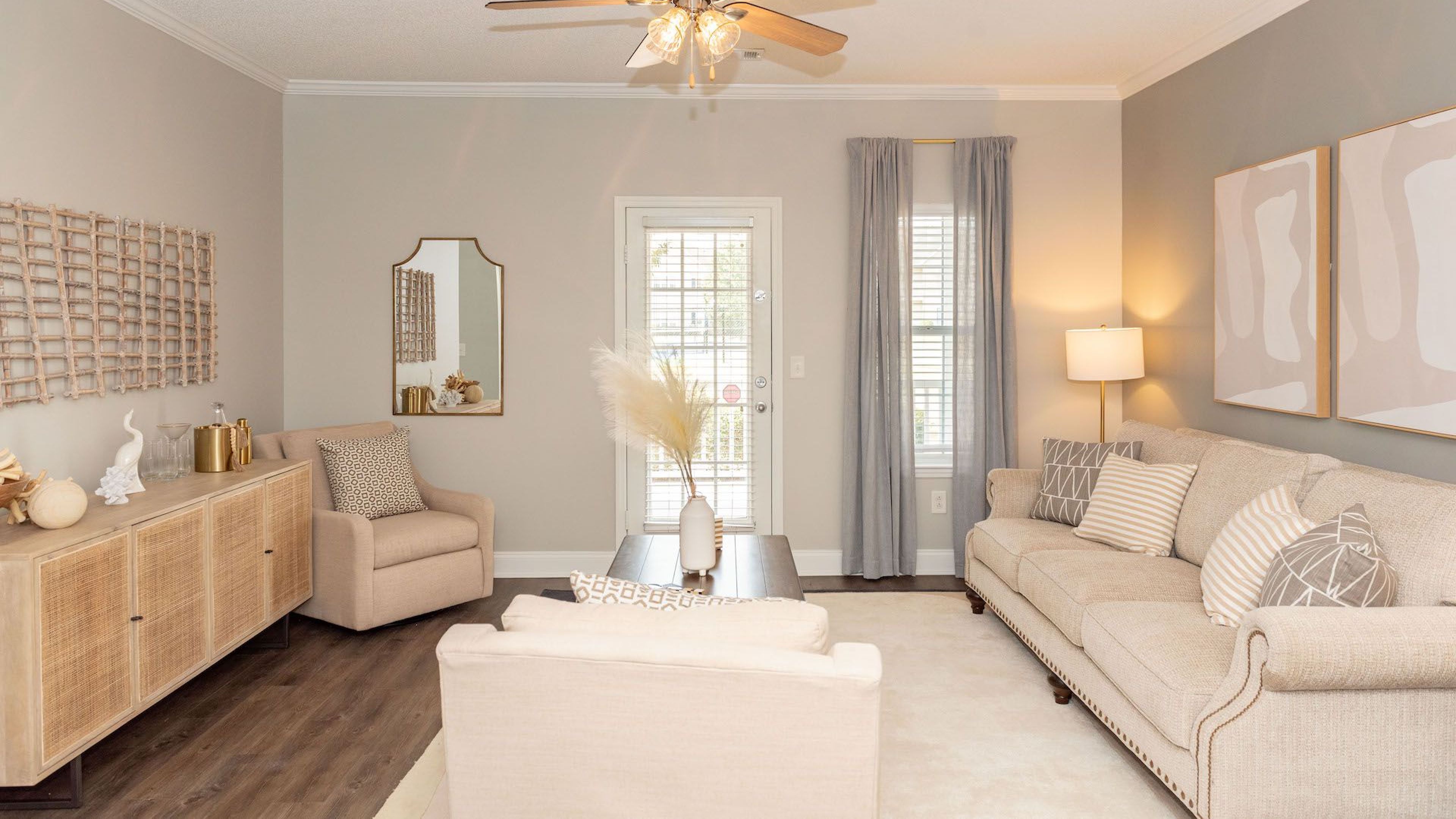 Cozy living room with neutral tones and modern decor at Hawthorne Meadowview apartments, GA