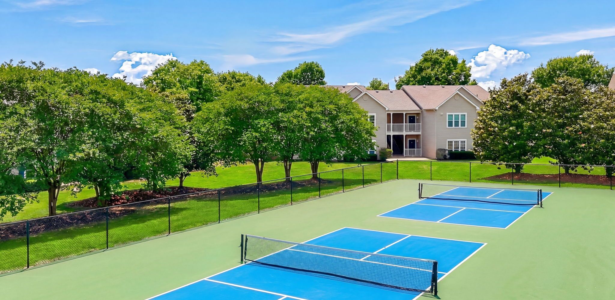 Professional tennis court for active living at Hawthorne Meadowview in Warner Robins, GA