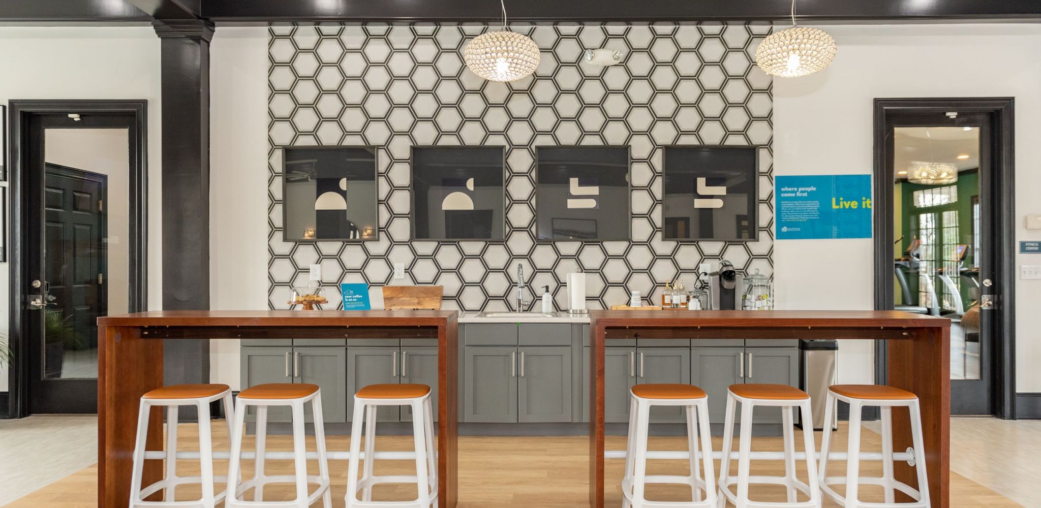 Stylish interior communal space with seating and decorative wall at Hawthorne Meadowview in Warner Robins, GA